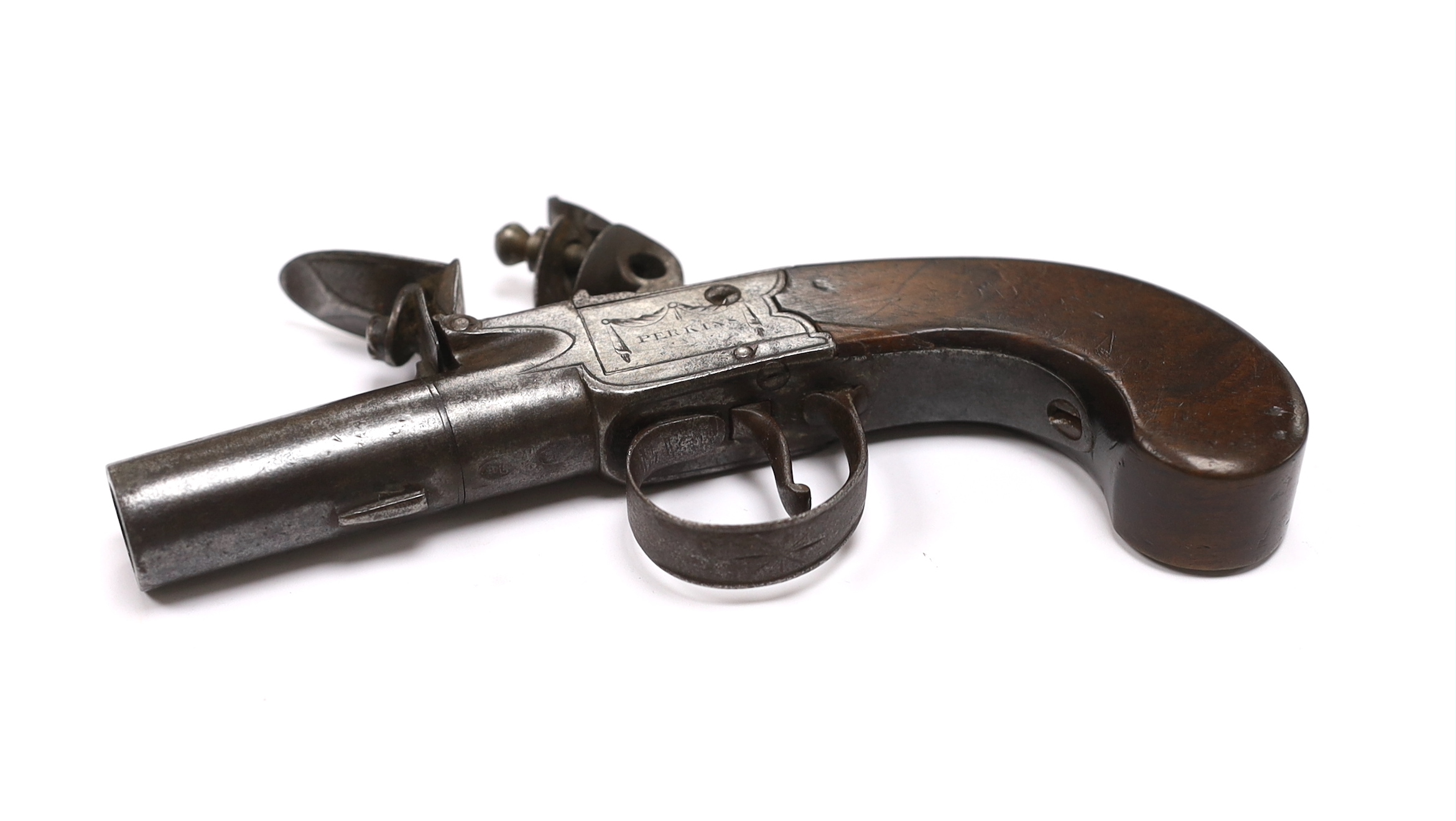 A small boxlock flintlock pistol by Perkins of London, with turn-off barrel, frame signed by the maker, with walnut slab grip, barrel 4.5cm
